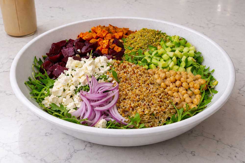 Colorful grain salad in ceramic bowl