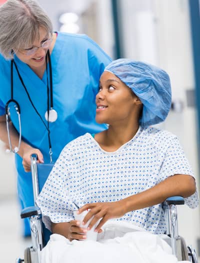 nurse taking patient to surgery